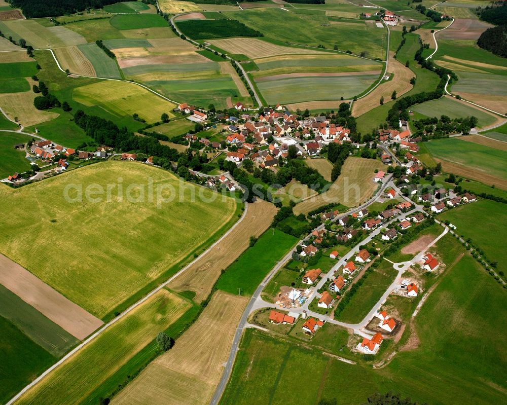 Elbersroth from above - Agricultural land and field boundaries surround the settlement area of the village in Elbersroth in the state Bavaria, Germany