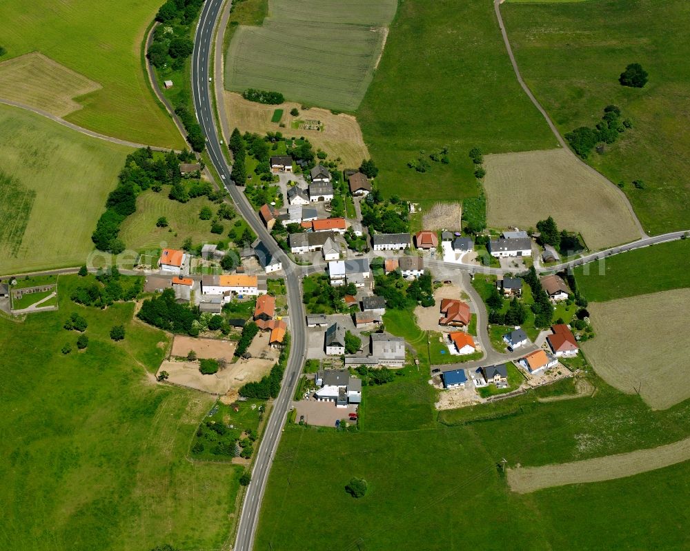 Aerial photograph Ellenberg - Agricultural land and field boundaries surround the settlement area of the village in Ellenberg in the state Rhineland-Palatinate, Germany