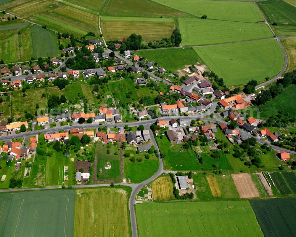 Ellershausen bei Münden from above - Agricultural land and field boundaries surround the settlement area of the village in Ellershausen bei Münden in the state Lower Saxony, Germany