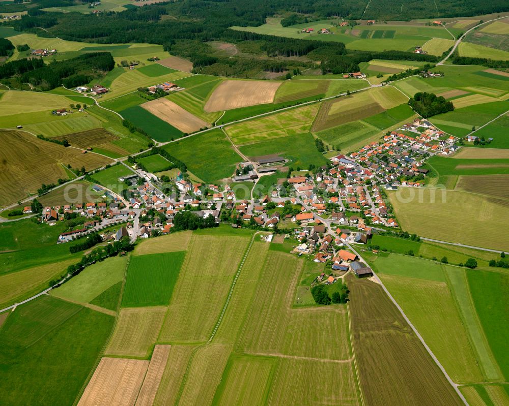 Ellwangen from above - Agricultural land and field boundaries surround the settlement area of the village in Ellwangen in the state Baden-Wuerttemberg, Germany