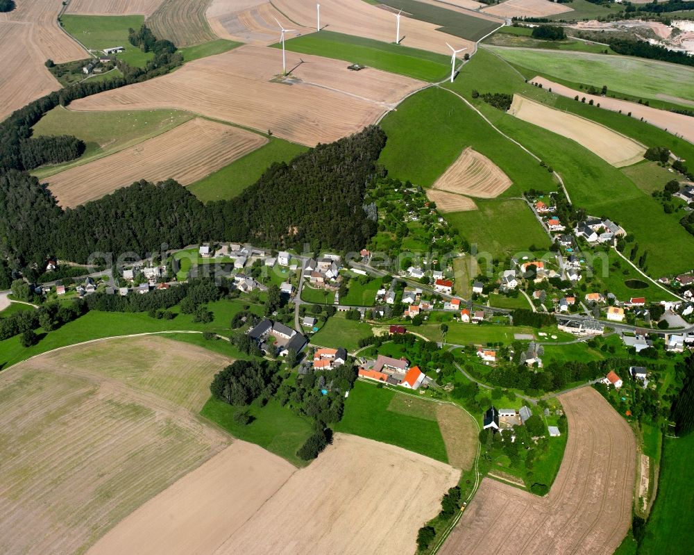 Elsdorf from the bird's eye view: Agricultural land and field boundaries surround the settlement area of the village in Elsdorf in the state Saxony, Germany