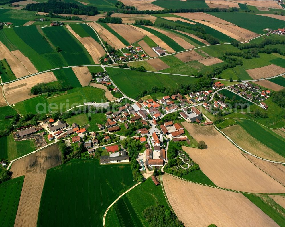 Emmersdorf from above - Agricultural land and field boundaries surround the settlement area of the village in Emmersdorf in the state Bavaria, Germany