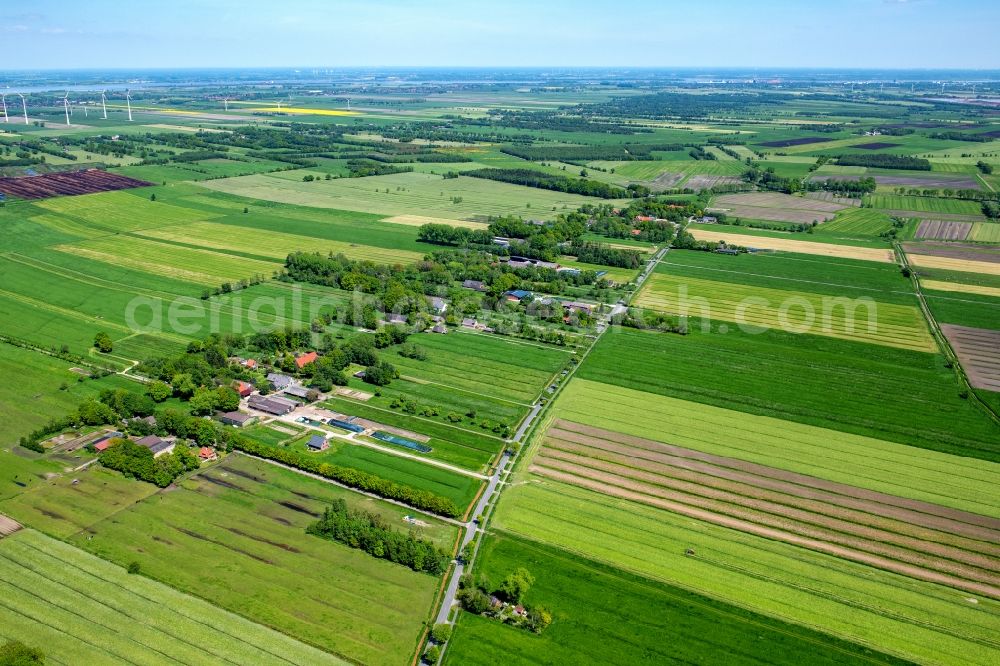 Engelschoff from above - Agricultural land and field boundaries surround the settlement area of the village in Engelschoff in the state Lower Saxony, Germany