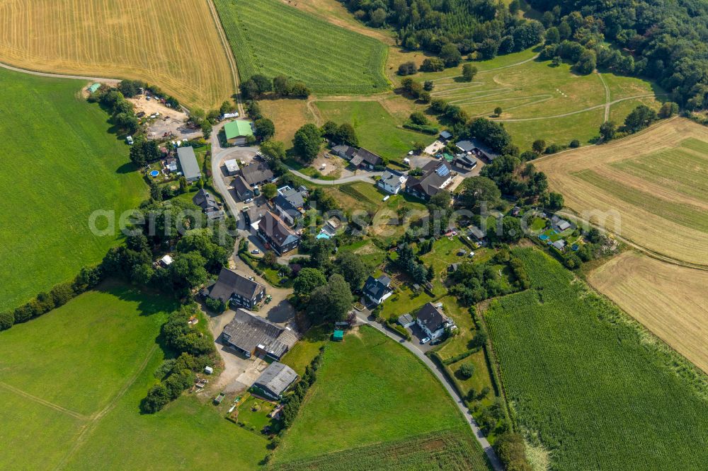 Ennepetal from above - Agricultural land and field boundaries surround the settlement area of the village in Ennepetal in the state North Rhine-Westphalia, Germany