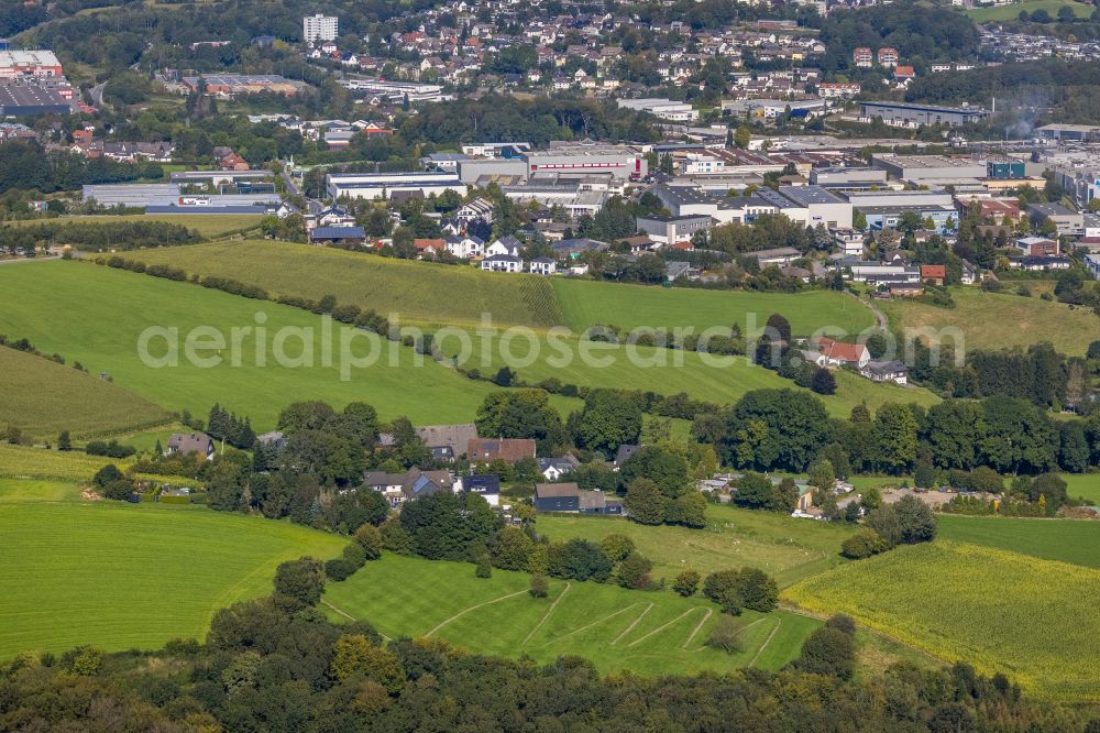 Ennepetal from above - Agricultural land and field boundaries surround the settlement area of the village in Ennepetal in the state North Rhine-Westphalia, Germany