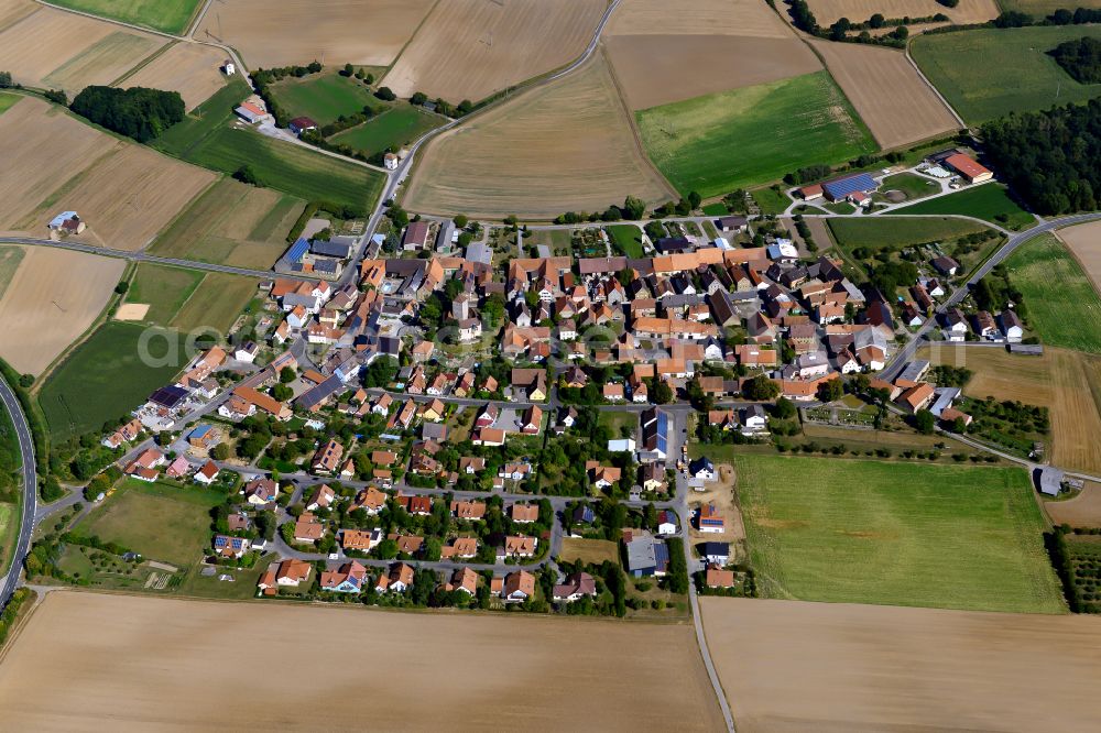 Aerial image Erlach - Agricultural land and field boundaries surround the settlement area of the village in Erlach in the state Bavaria, Germany