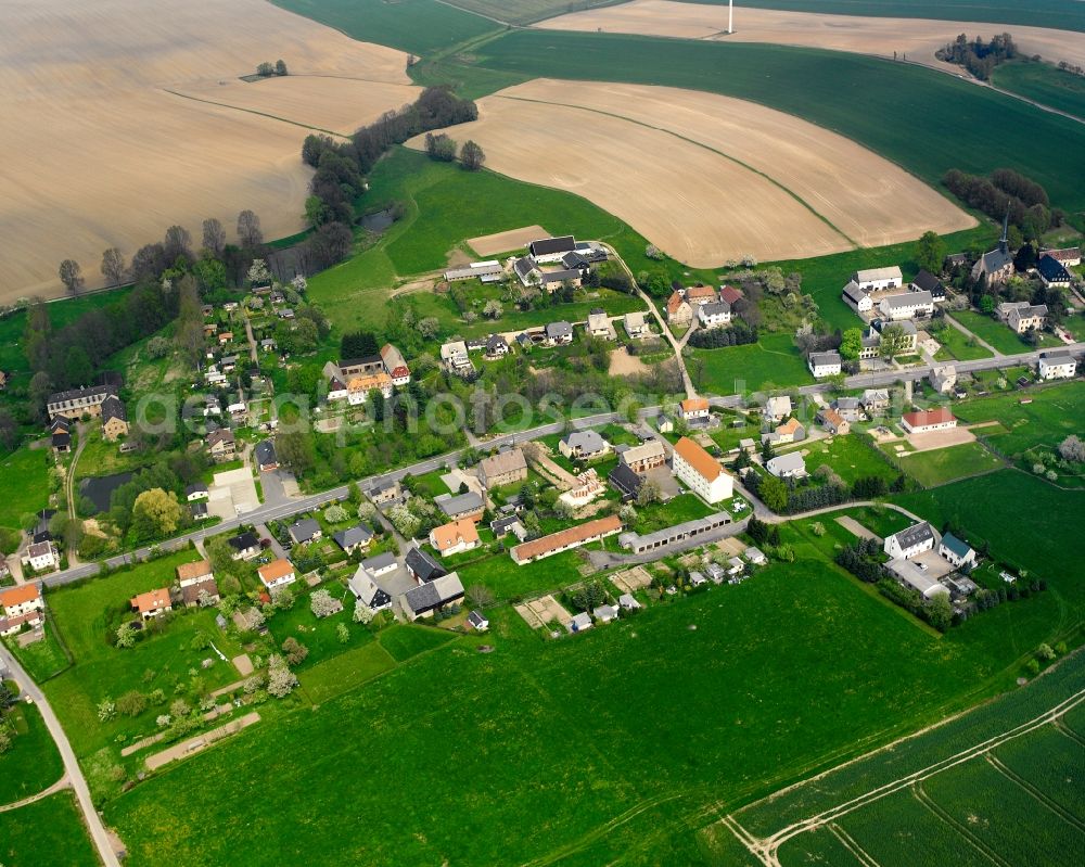 Erlau from above - Agricultural land and field boundaries surround the settlement area of the village in Erlau in the state Saxony, Germany