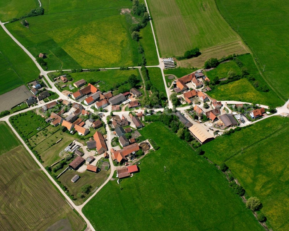 Aerial image Erlbach - Agricultural land and field boundaries surround the settlement area of the village in Erlbach in the state Bavaria, Germany