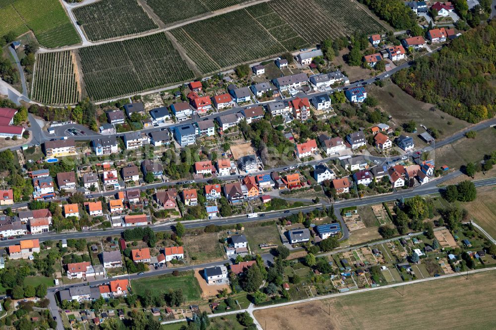 Aerial image Erlenbach bei Marktheidenfeld - Agricultural land and field boundaries surround the settlement area of the village in Erlenbach bei Marktheidenfeld in the state Bavaria, Germany