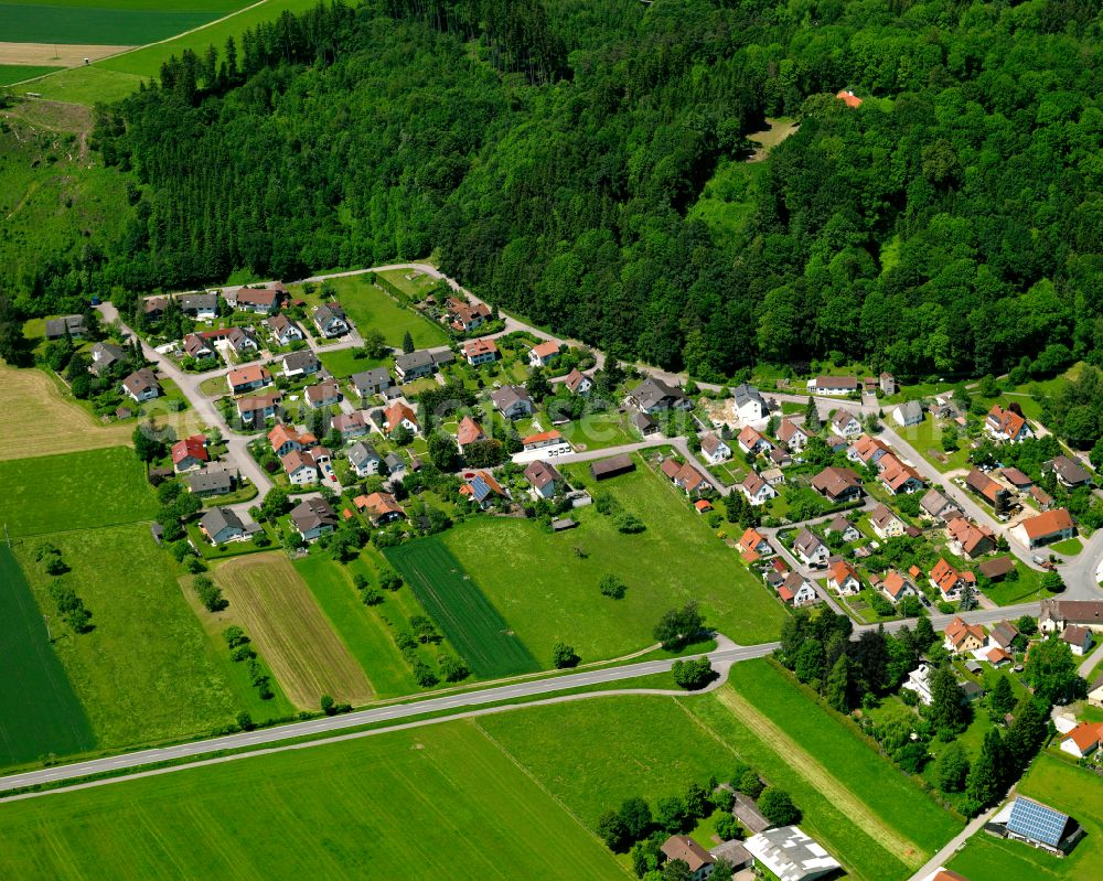 Aerial photograph Erolzheim - Agricultural land and field boundaries surround the settlement area of the village in Erolzheim in the state Baden-Wuerttemberg, Germany