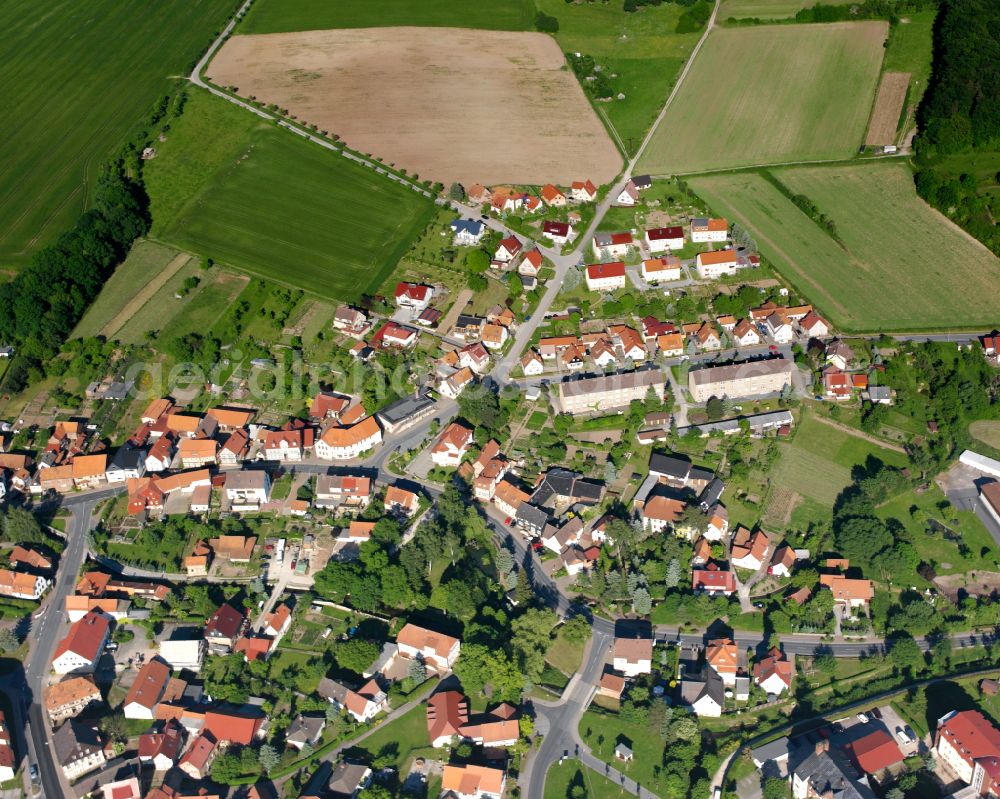 Aerial image Ershausen - Agricultural land and field boundaries surround the settlement area of the village in Ershausen in the state Thuringia, Germany