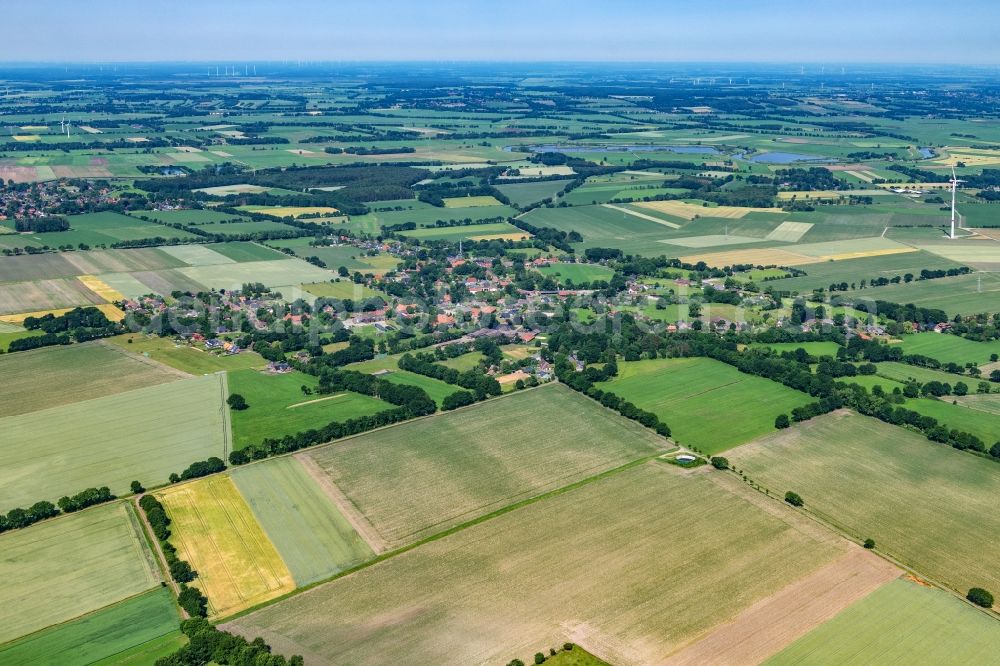 Estorf from above - Agricultural land and field boundaries surround the settlement area of a??a??the village in Estorf in the state Lower Saxony, Germany