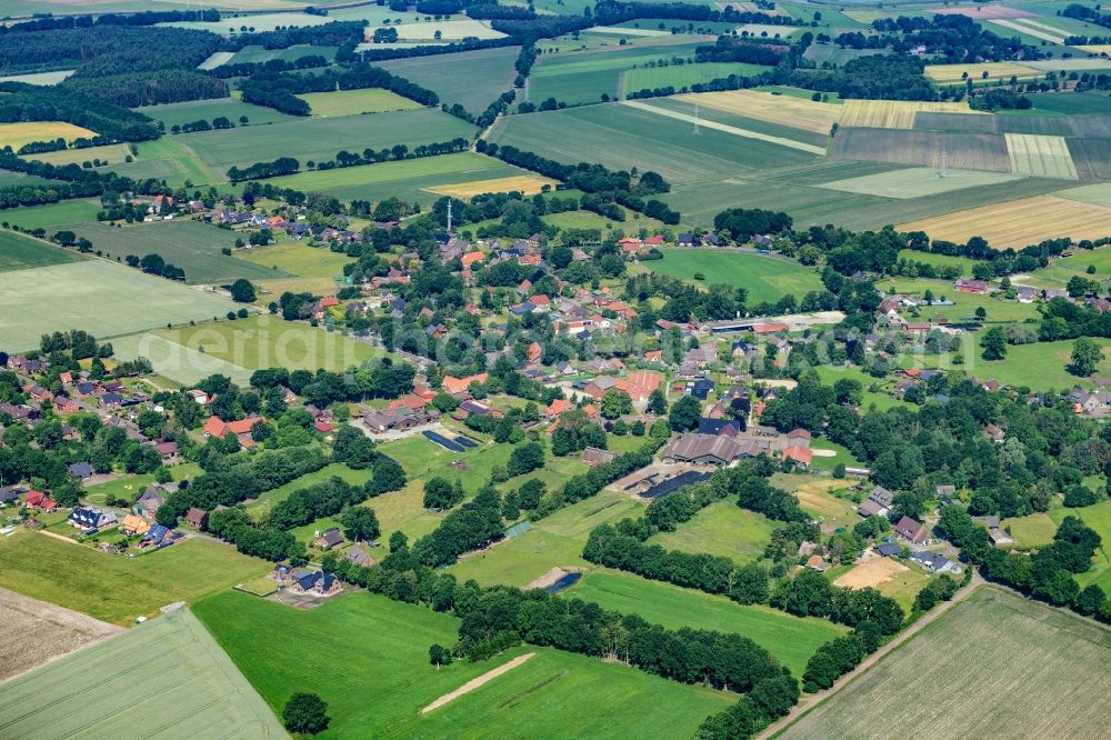 Estorf from the bird's eye view: Agricultural land and field boundaries surround the settlement area of a??a??the village in Estorf in the state Lower Saxony, Germany