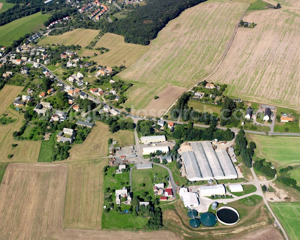 Etzdorf from the bird's eye view: Agricultural land and field boundaries surround the settlement area of the village in Etzdorf in the state Saxony, Germany