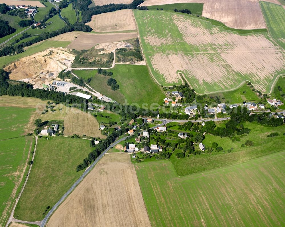 Etzdorf from the bird's eye view: Agricultural land and field boundaries surround the settlement area of the village in Etzdorf in the state Saxony, Germany