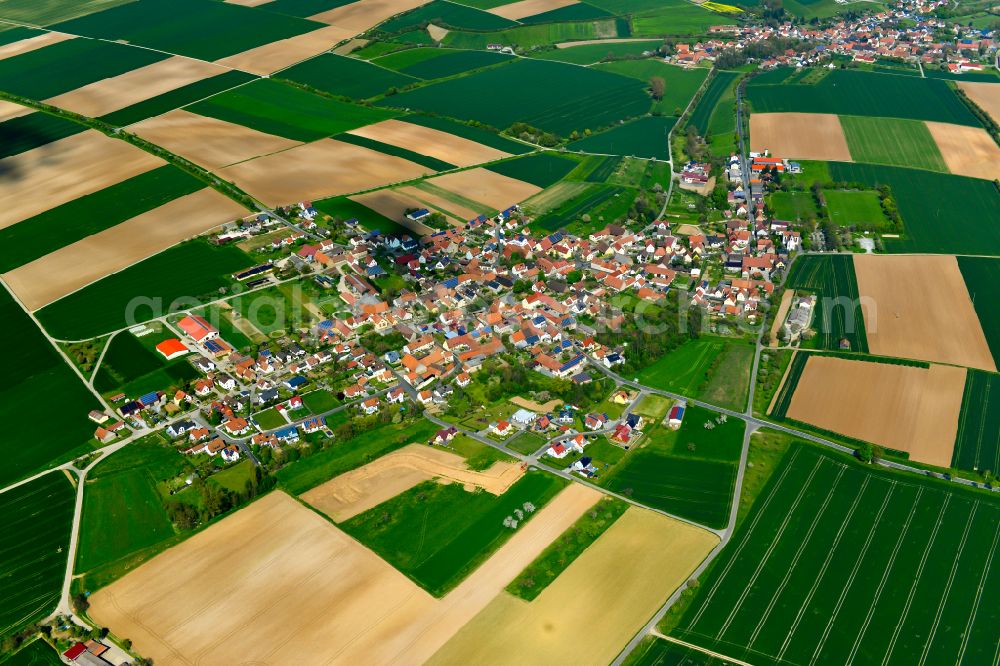 Aerial photograph Euerfeld - Agricultural land and field boundaries surround the settlement area of the village in Euerfeld in the state Bavaria, Germany