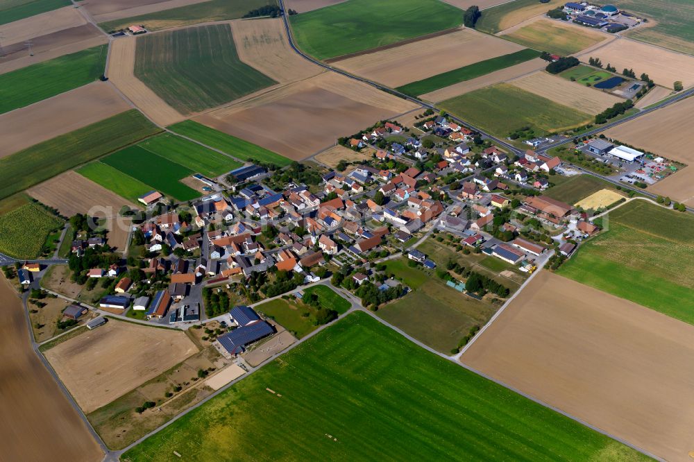 Aerial photograph Euerhausen - Agricultural land and field boundaries surround the settlement area of the village in Euerhausen in the state Bavaria, Germany