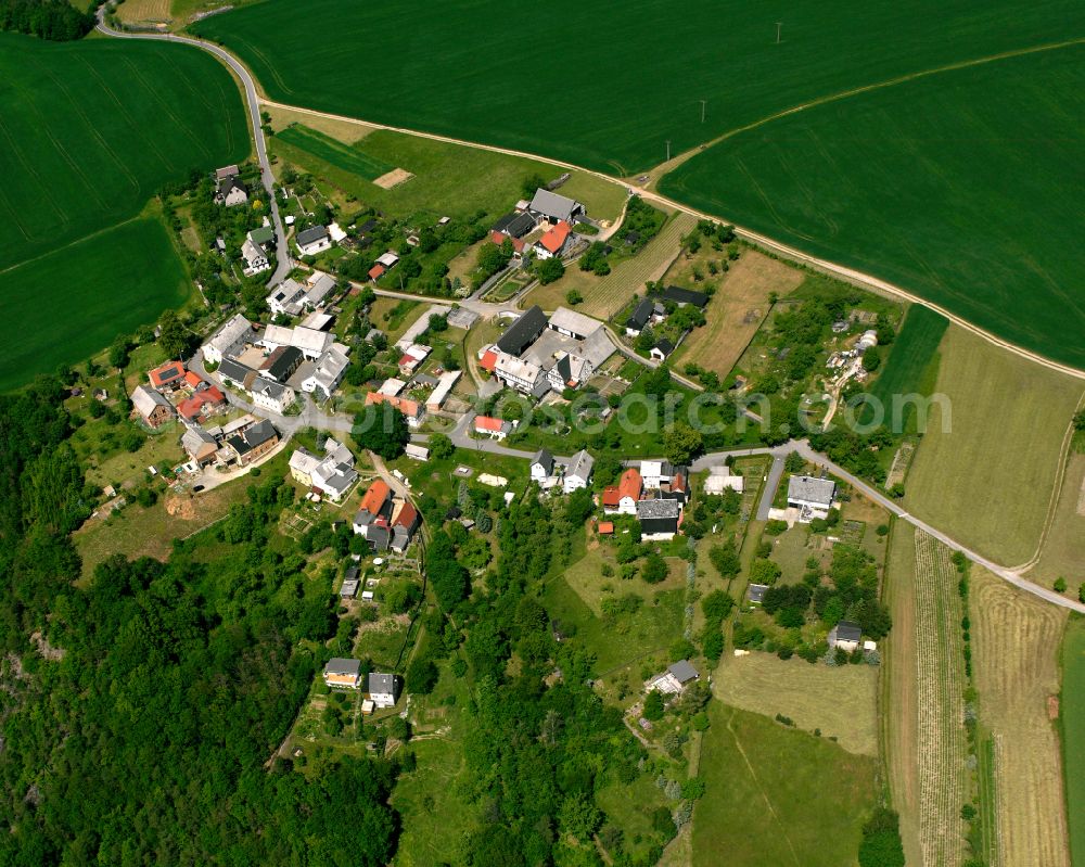 Eula from the bird's eye view: Agricultural land and field boundaries surround the settlement area of the village in Eula in the state Thuringia, Germany