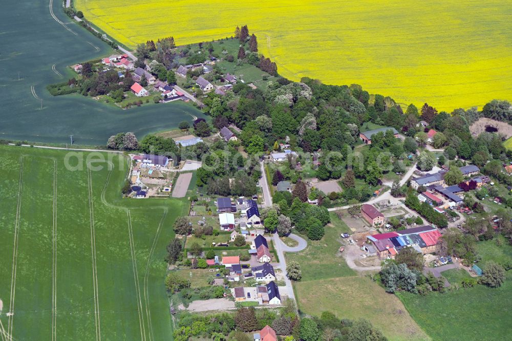 Fahren from the bird's eye view: Agricultural land and field boundaries surround the settlement area of the village in Fahren in the state Mecklenburg - Western Pomerania, Germany