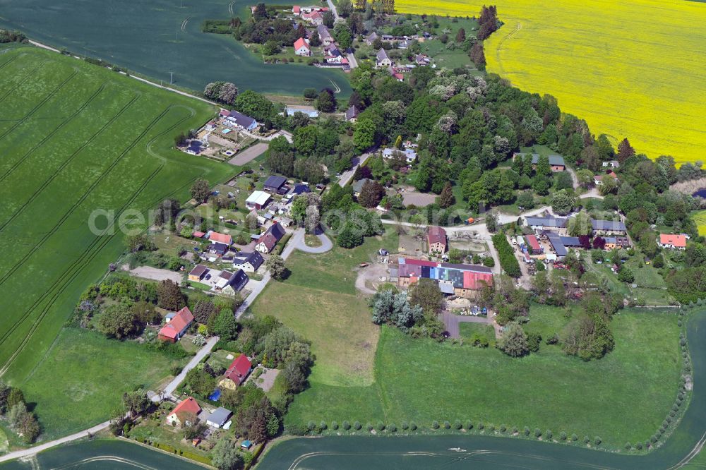 Fahren from above - Agricultural land and field boundaries surround the settlement area of the village in Fahren in the state Mecklenburg - Western Pomerania, Germany