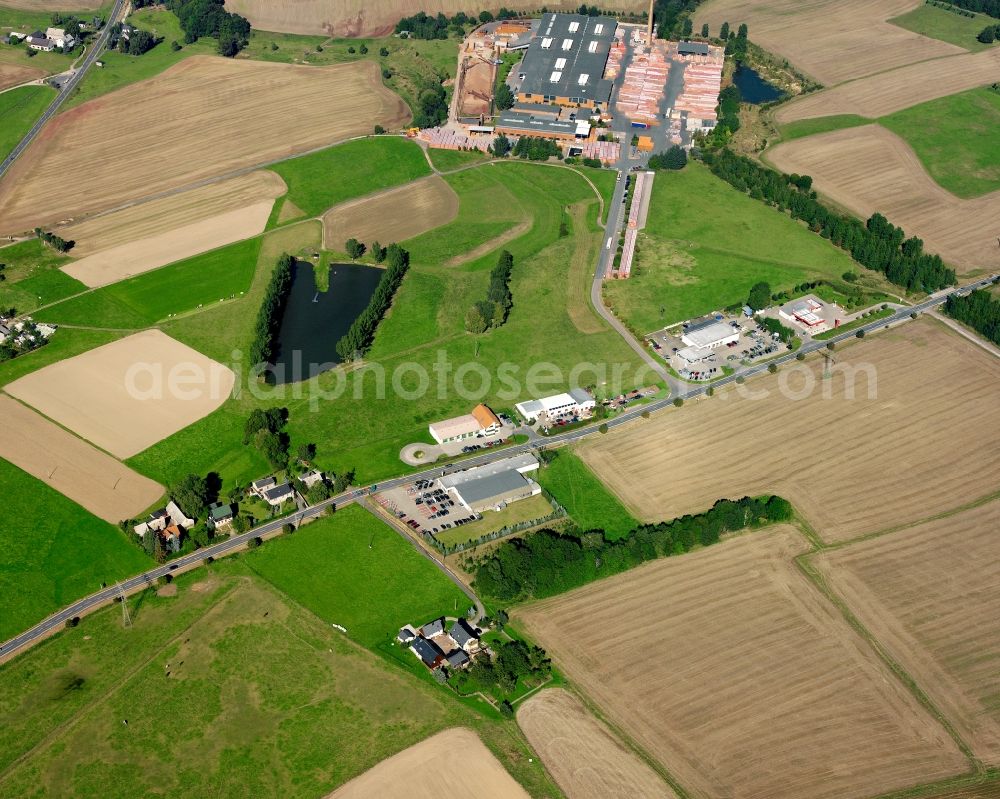 Falkenau from the bird's eye view: Agricultural land and field boundaries surround the settlement area of the village in Falkenau in the state Saxony, Germany