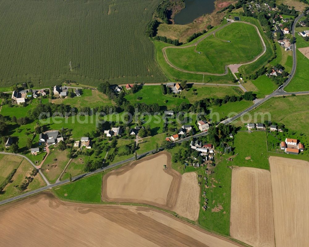 Aerial image Falkenau - Agricultural land and field boundaries surround the settlement area of the village in Falkenau in the state Saxony, Germany