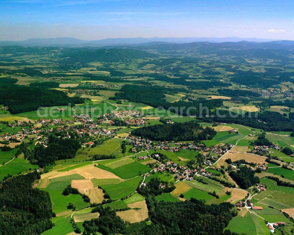 Falkenfels from the bird's eye view: Agricultural land and field boundaries surround the settlement area of the village in Falkenfels in the state Bavaria, Germany