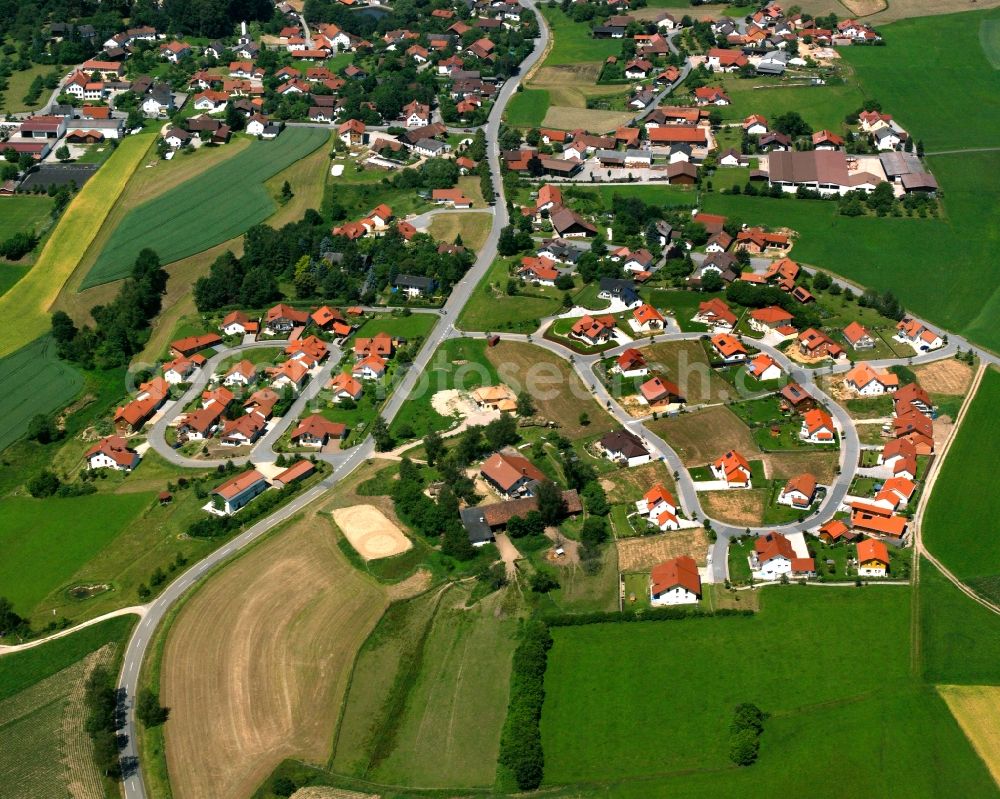 Falkenfels from above - Agricultural land and field boundaries surround the settlement area of the village in Falkenfels in the state Bavaria, Germany