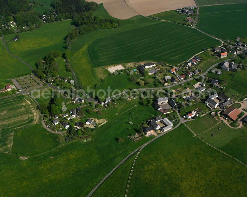 Falkenhain from the bird's eye view: Agricultural land and field boundaries surround the settlement area of the village in Falkenhain in the state Saxony, Germany