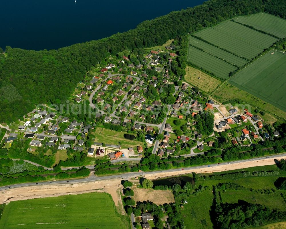 Aerial image Farchauer Mühle - Agricultural land and field boundaries surround the settlement area of the village in Farchauer Mühle in the state Schleswig-Holstein, Germany