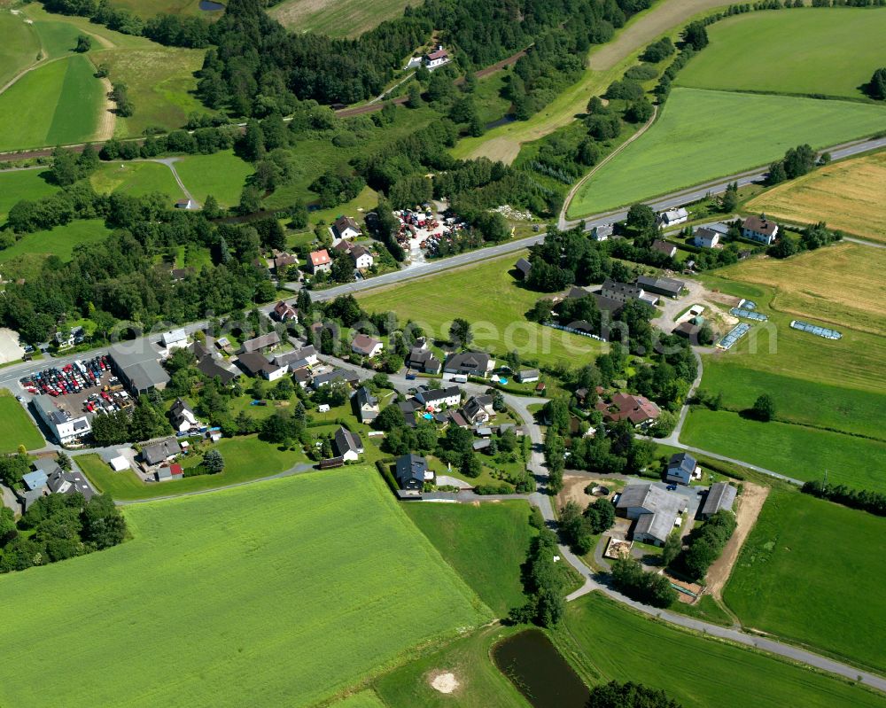 Fattigau from the bird's eye view: Agricultural land and field boundaries surround the settlement area of the village in Fattigau in the state Bavaria, Germany