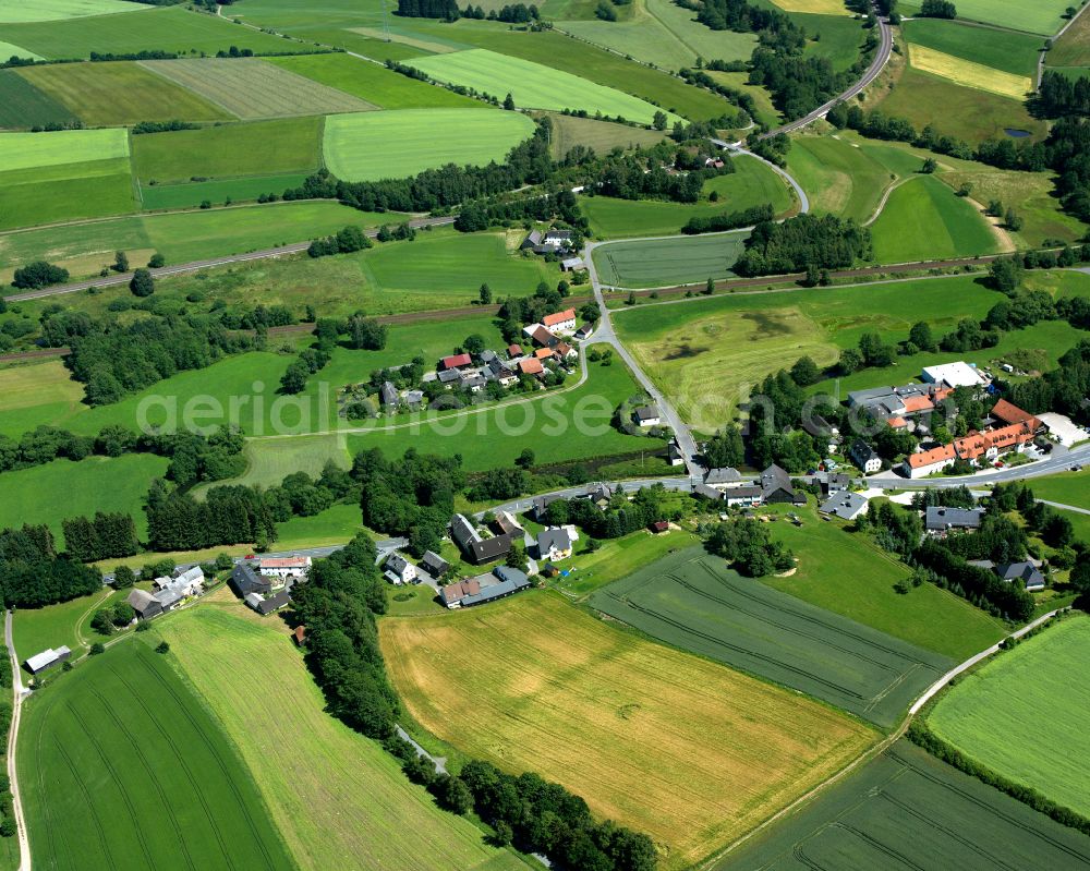 Aerial image Fattigau - Agricultural land and field boundaries surround the settlement area of the village in Fattigau in the state Bavaria, Germany