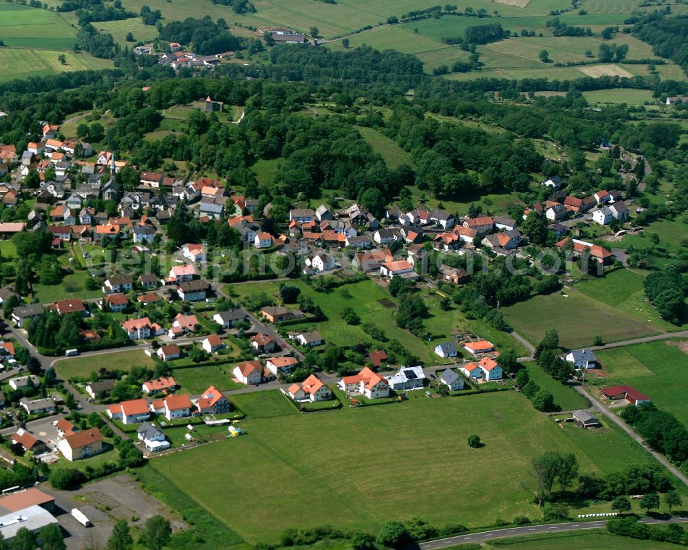 Ferienpark Burgblick from the bird's eye view: Agricultural land and field boundaries surround the settlement area of the village in Ferienpark Burgblick in the state Hesse, Germany