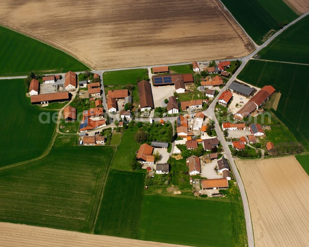 Fierlbach from above - Agricultural land and field boundaries surround the settlement area of the village in Fierlbach in the state Bavaria, Germany