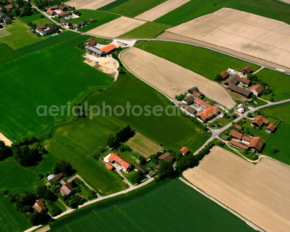 Figling from above - Agricultural land and field boundaries surround the settlement area of the village in Figling in the state Bavaria, Germany