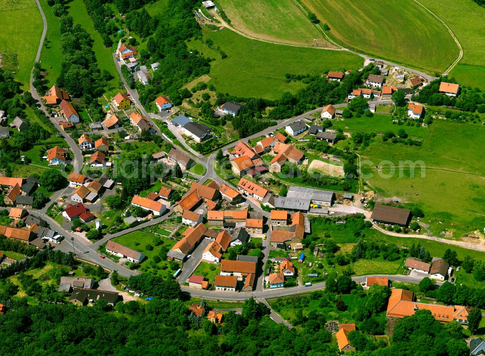 Finkenbach-Gersweiler from above - Agricultural land and field boundaries surround the settlement area of the village in Finkenbach-Gersweiler in the state Rhineland-Palatinate, Germany