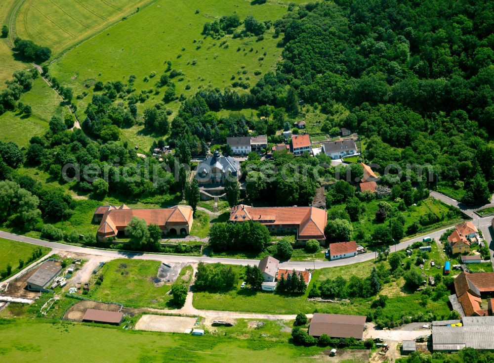 Finkenbach-Gersweiler from the bird's eye view: Agricultural land and field boundaries surround the settlement area of the village in Finkenbach-Gersweiler in the state Rhineland-Palatinate, Germany