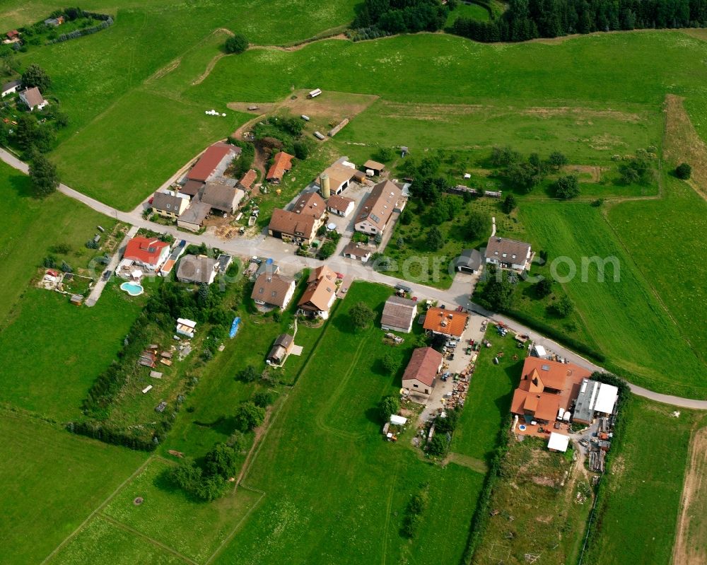 Finsterrot from above - Agricultural land and field boundaries surround the settlement area of the village in Finsterrot in the state Baden-Wuerttemberg, Germany