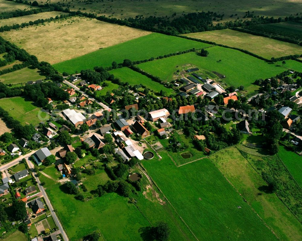 Fitzen from the bird's eye view: Agricultural land and field boundaries surround the settlement area of the village in Fitzen in the state Schleswig-Holstein, Germany