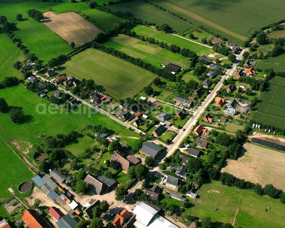 Aerial image Fitzen - Agricultural land and field boundaries surround the settlement area of the village in Fitzen in the state Schleswig-Holstein, Germany