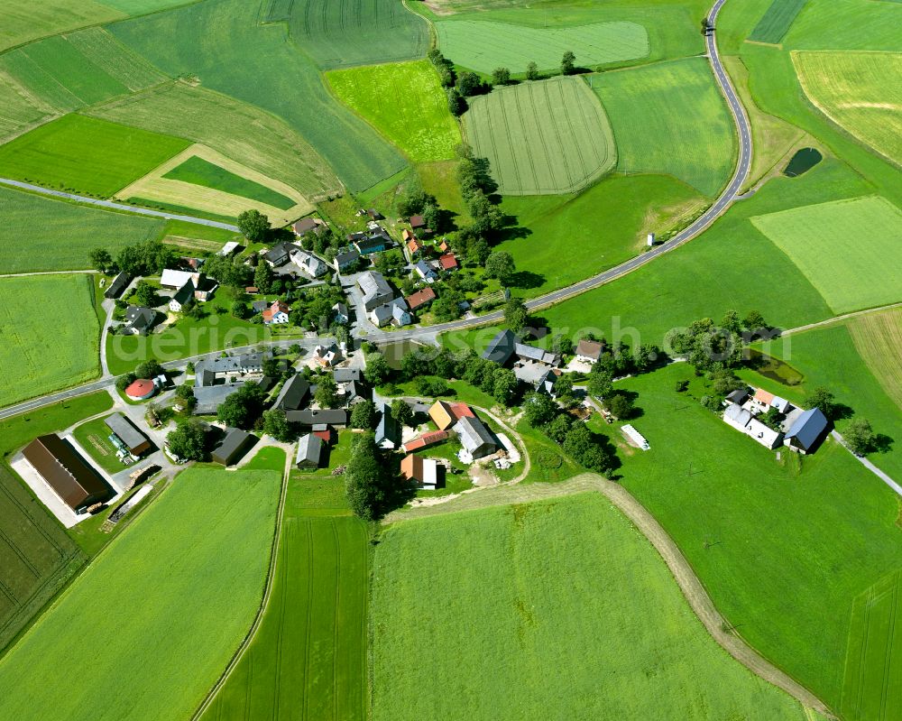 Fleisnitz from the bird's eye view: Agricultural land and field boundaries surround the settlement area of the village in Fleisnitz in the state Bavaria, Germany