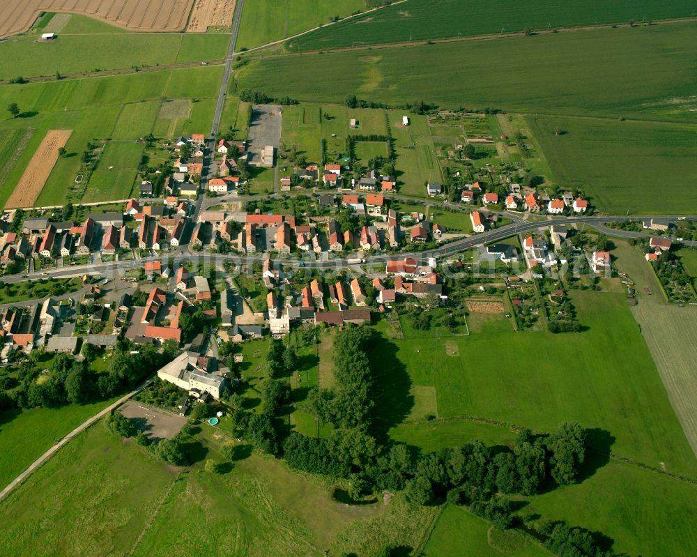 Folbern from above - Agricultural land and field boundaries surround the settlement area of the village in Folbern in the state Saxony, Germany