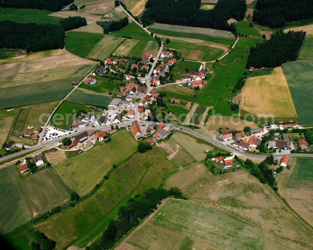 Forndorf from above - Agricultural land and field boundaries surround the settlement area of the village in Forndorf in the state Bavaria, Germany