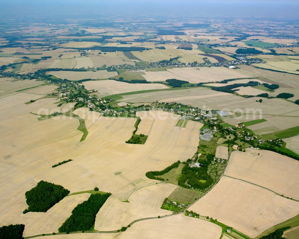 Frankenau from above - Agricultural land and field boundaries surround the settlement area of the village in Frankenau in the state Saxony, Germany