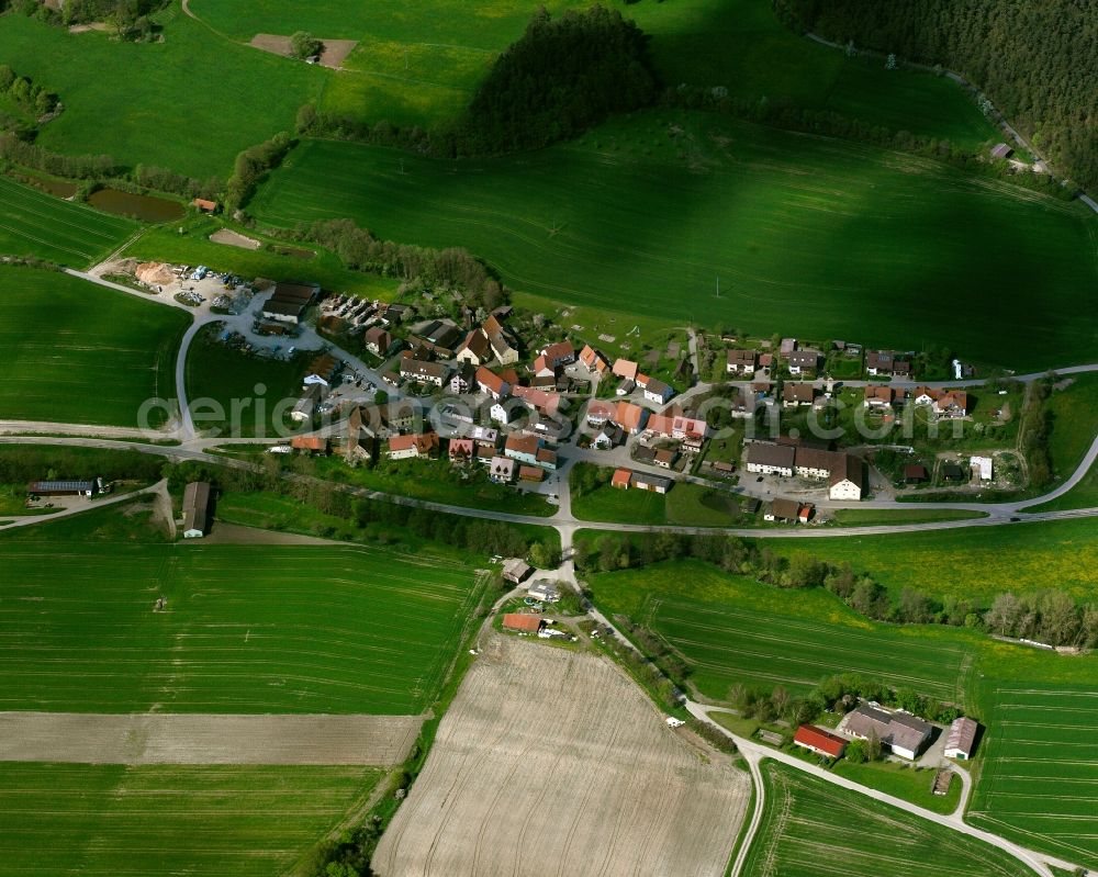 Frankendorf from the bird's eye view: Agricultural land and field boundaries surround the settlement area of the village in Frankendorf in the state Bavaria, Germany