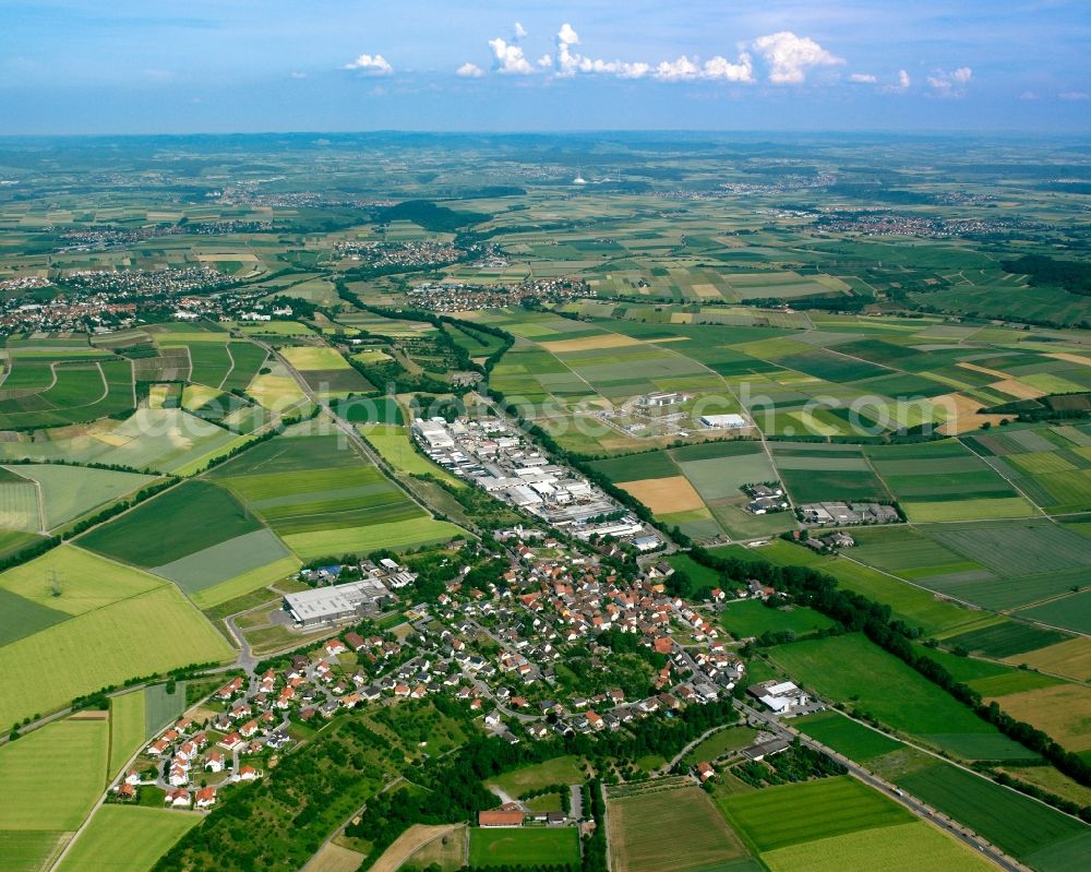 Aerial image Frauenzimmern - Agricultural land and field boundaries surround the settlement area of the village in Frauenzimmern in the state Baden-Wuerttemberg, Germany