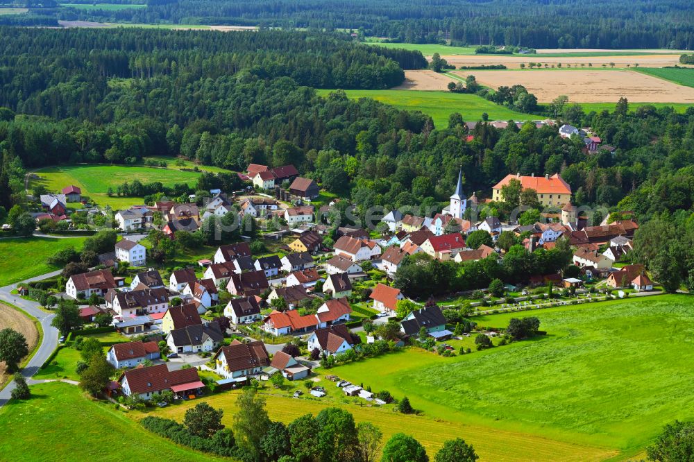 Freienfels from above - Agricultural land and field boundaries surround the settlement area of the village in Freienfels in the state Bavaria, Germany