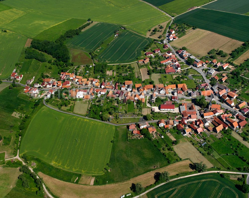 Aerial image Freienhagen - Agricultural land and field boundaries surround the settlement area of the village in Freienhagen in the state Thuringia, Germany