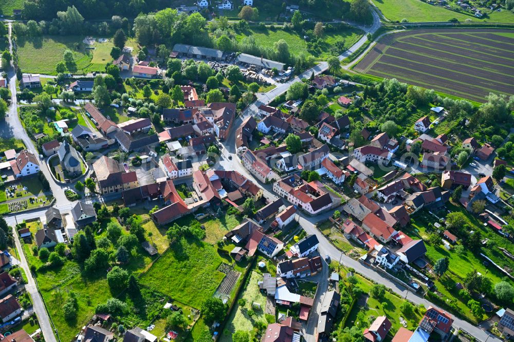 Freienorla from above - Agricultural land and field boundaries surround the settlement area of the village in Freienorla in the state Thuringia, Germany