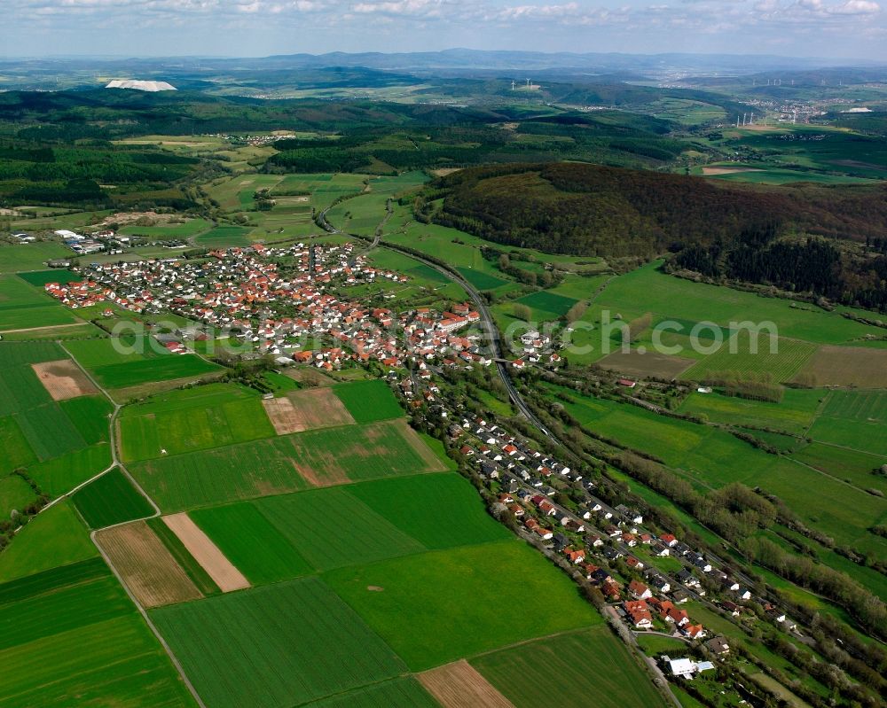 Aerial image Friedewald - Agricultural land and field boundaries surround the settlement area of the village in Friedewald in the state Hesse, Germany